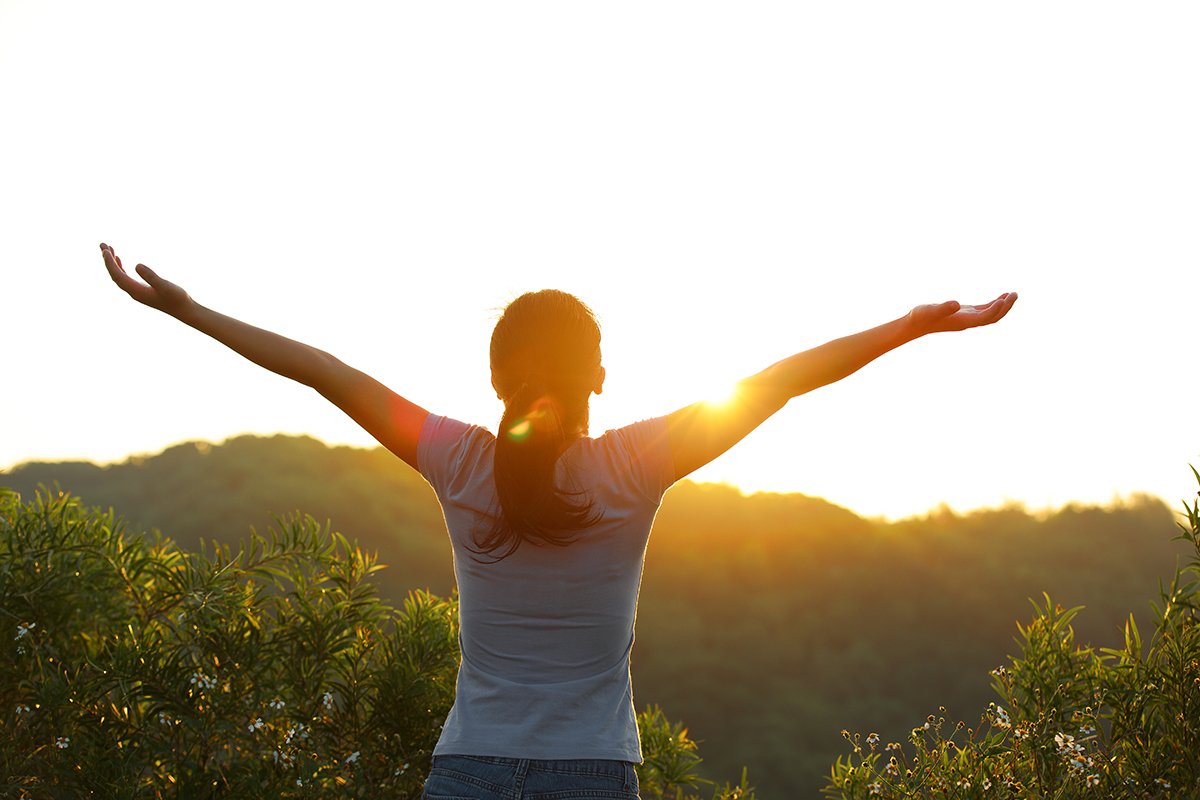 happy healthy person at sunrise