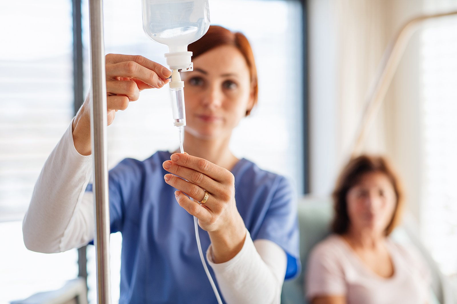 Nurse doing IV therapy with patient
